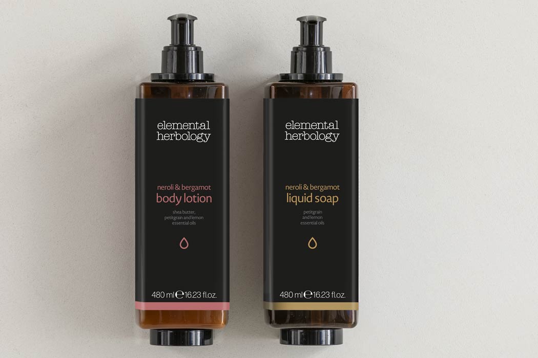 Hotel toiletries elemental herbology pump dispenser bottles