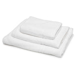 Stack of 500gsm white hotel bath and hand towels