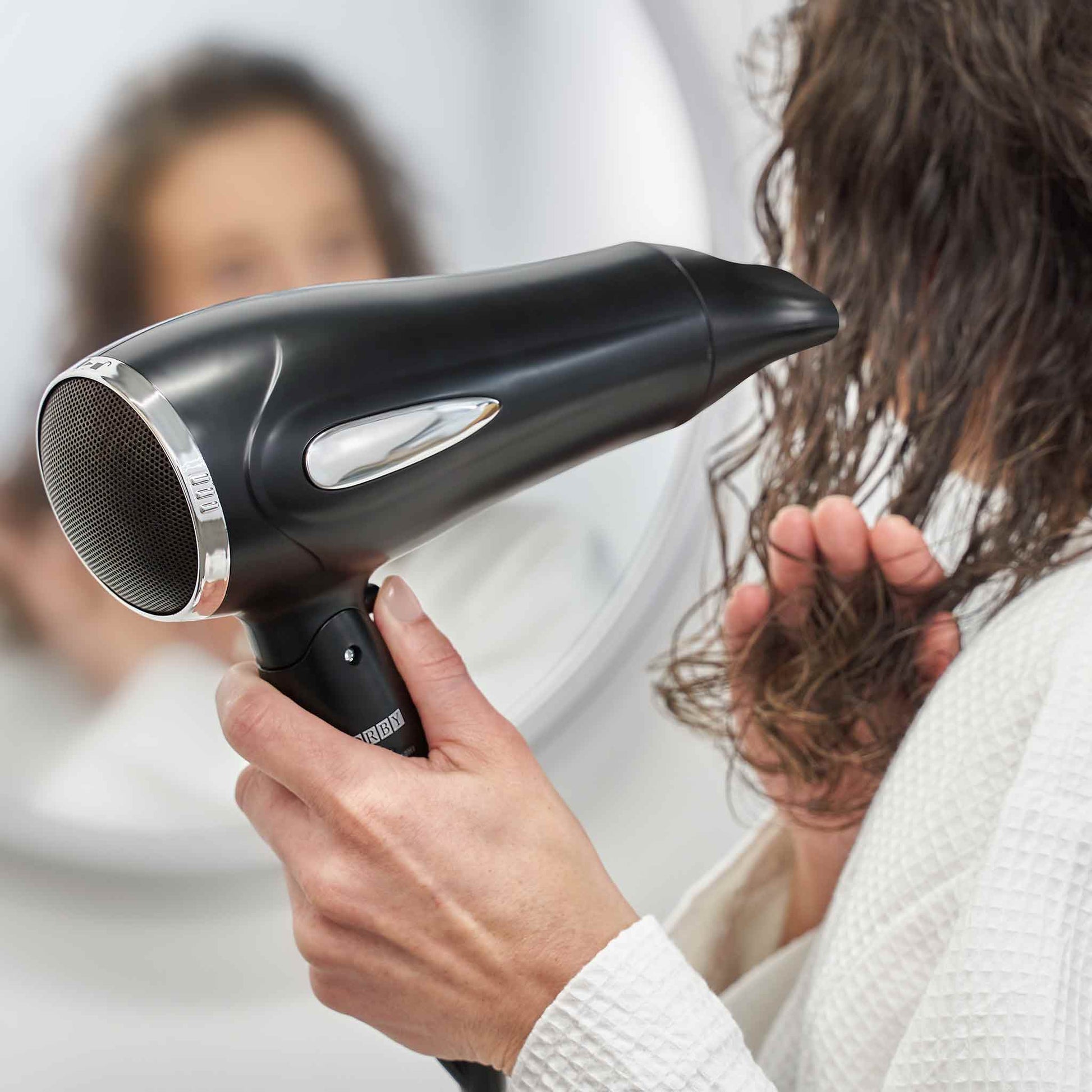 Corby Bedford hairdryer being used by hotel guest