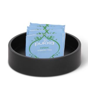 Bentley Ibu round black amenity tray in small size with tea sachets 