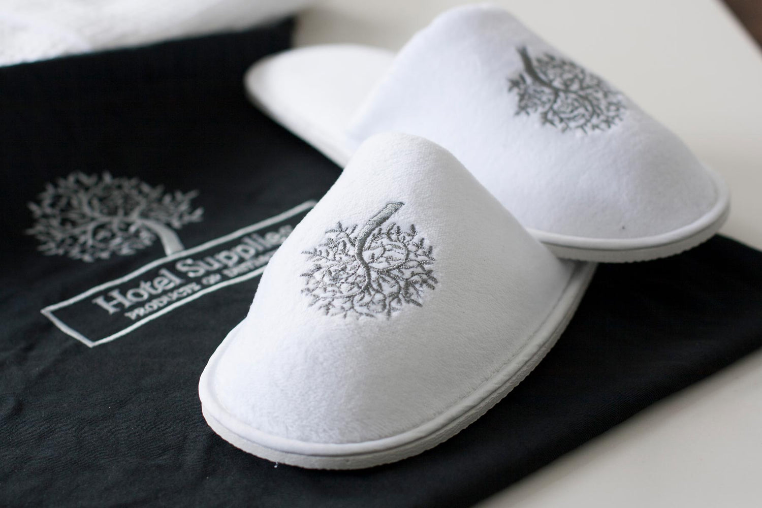 Hotel supplies bespoke products including slippers and bags