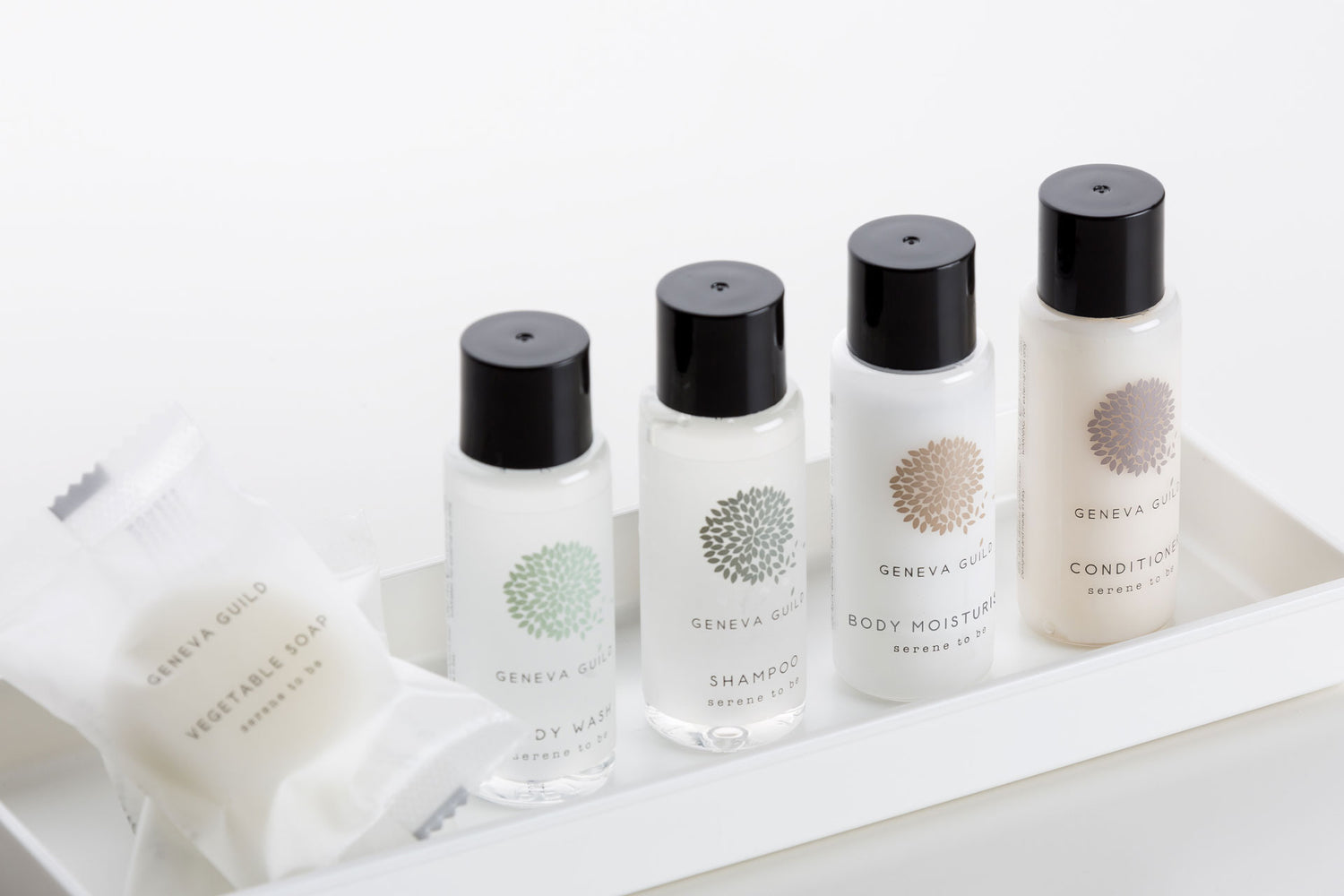 Luxury hotel toiletries collection featuring miniatures, pump dispensers and bulk refills
