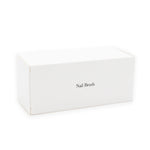 Nail brush in white box, hotel amenities