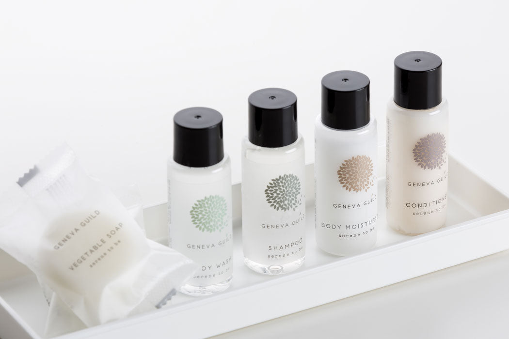 Geneva Guild hotel toiletries featuring miniature shampoo and shower gel