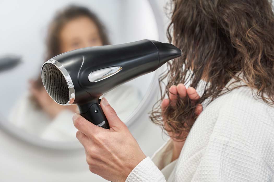 Hotel hairdryer being used by guest