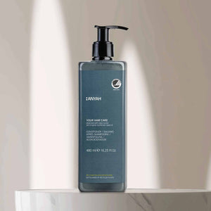 Anyah 480ml hair conditioner in non-refillable pump dispenser, enriched with shea butter and organic sunflower seed oil, displayed on marble bathroom surface