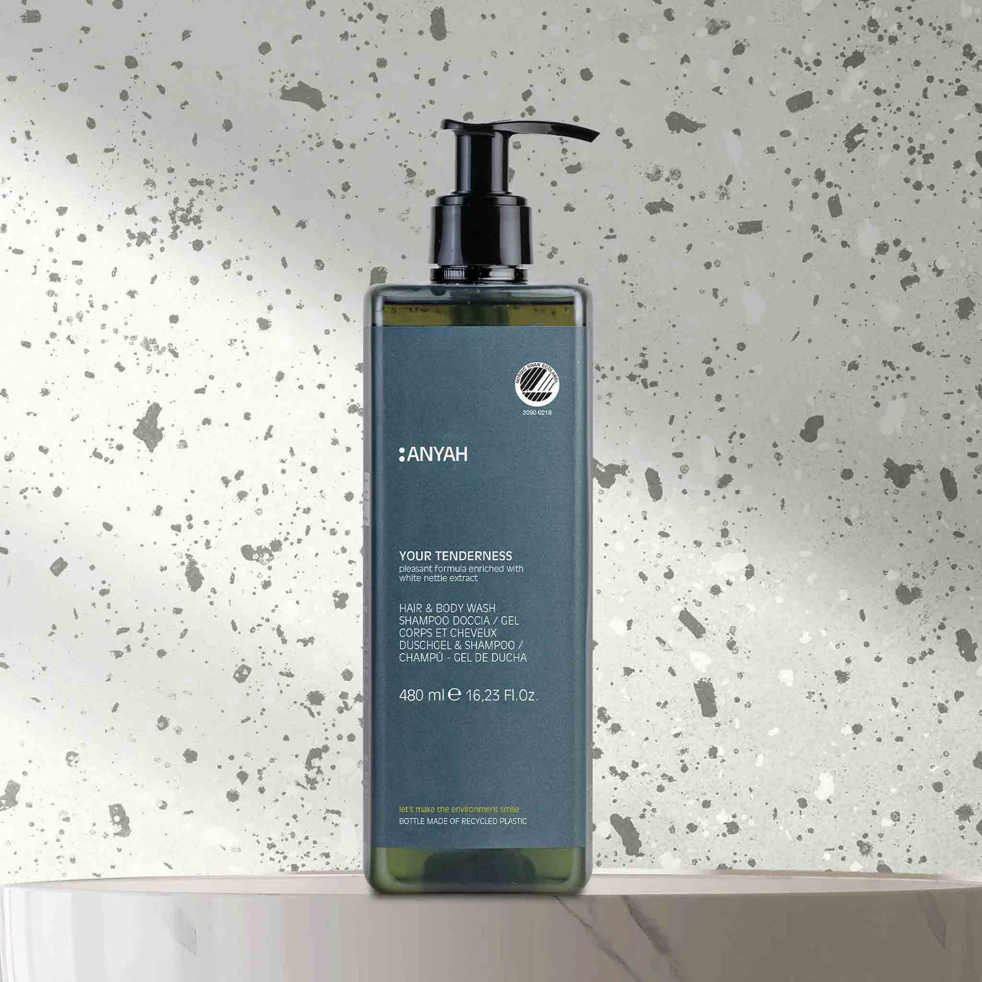 Anyah 480ml gentle hair and body wash in eco-friendly pump dispenser, displayed on terrazzo bathroom surface with minimalist design