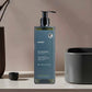Anyah 480ml liquid hand soap in pump dispenser bottle, placed beside wash basin in modern hotel bathroom setting