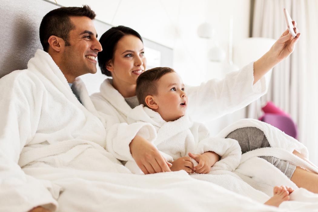 Beat the chill with guest amenities blog featuring a family in bathrobes