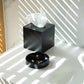 Lifestyle image of black Bentley Baker cube tissue box in hotel bathroom