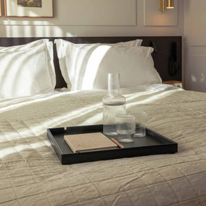 Bentley black Maroa hospitality tray on hotel bed