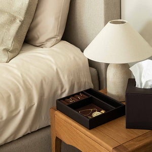 Brown leatherette Andros jewellery tray on hotel bedside table