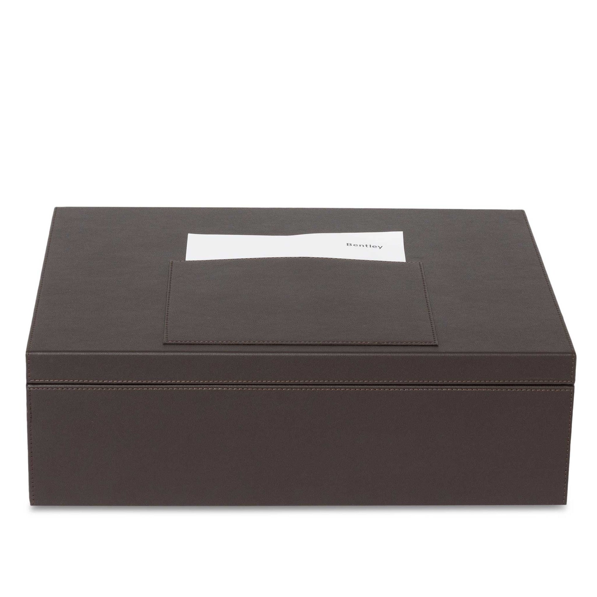 Bentley Capri brown leather hotel laundry box with lid shut and name tag on top