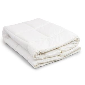 A folded white quilted mattress topper on a clean white background.