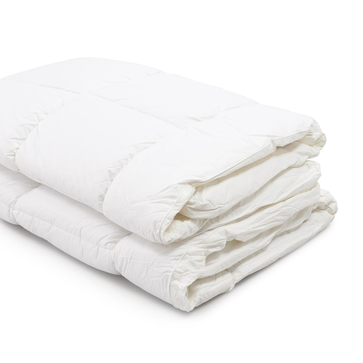 A folded white mattress topper on a clean white background.