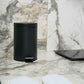 Corby Croft 3 litre black pedal bin in marble hotel bathroom beside digital scale and guest slippers