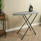 Corby Berkshire compact ironing board with light grey cover and black frame shown in hotel guest room setting with iron placed on top
