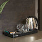 Corby Buckingham chrome hospitality kettle with mugs and beverage tray set up on hotel guest room refreshment station