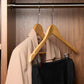 Corby Burlington light wood hotel security hanger with chrome clips holding guest trousers on anti-theft rail in wardrobe