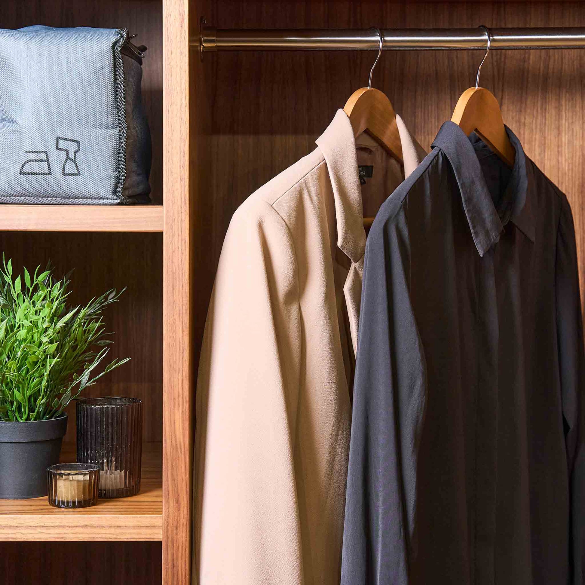 Corby Chelsea light wood guest hangers with chrome hooks holding jacket and shirt in guest room wardrobe