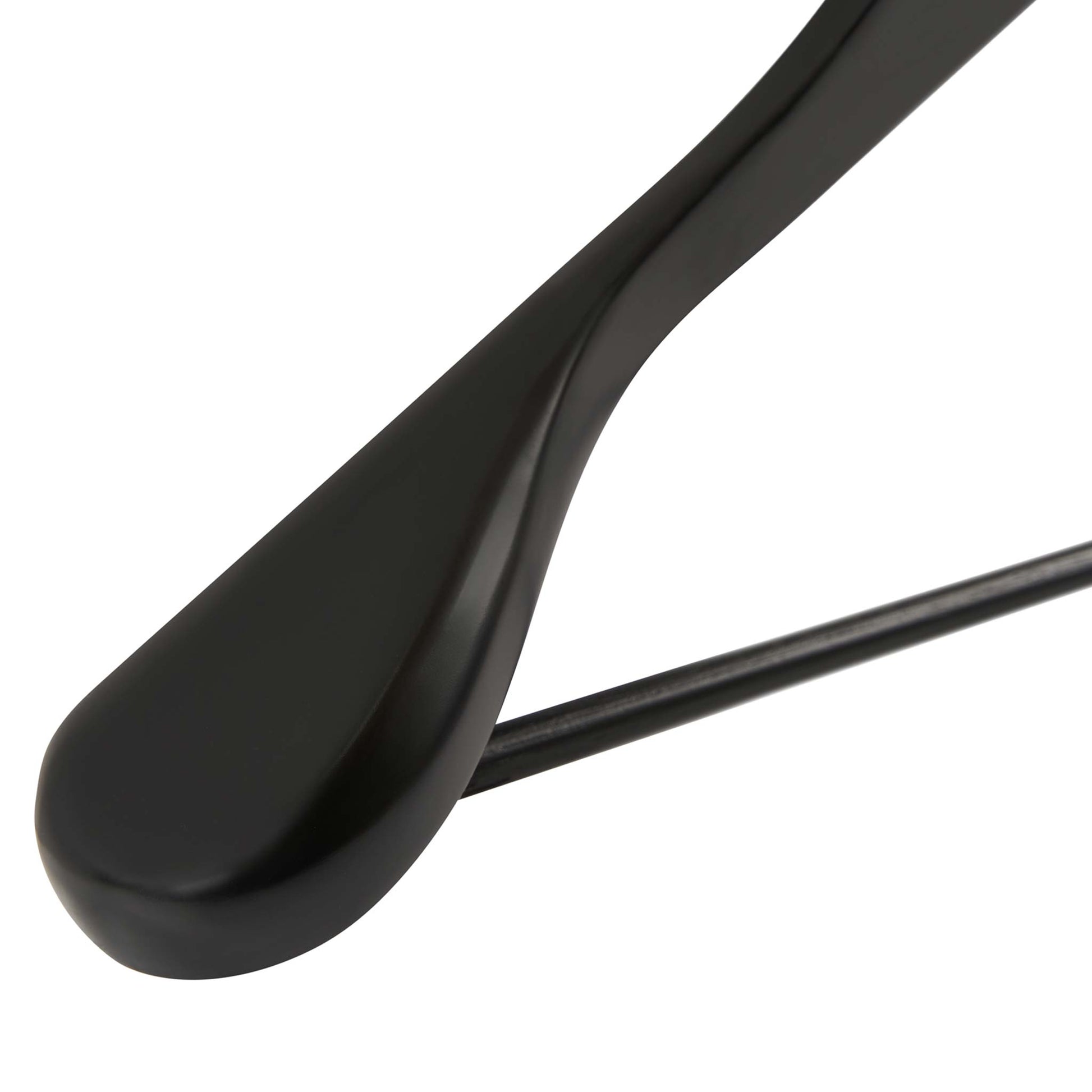 Close-up of Corby Clifford black wooden hotel suit hanger showing broad contoured shoulder and trouser bar