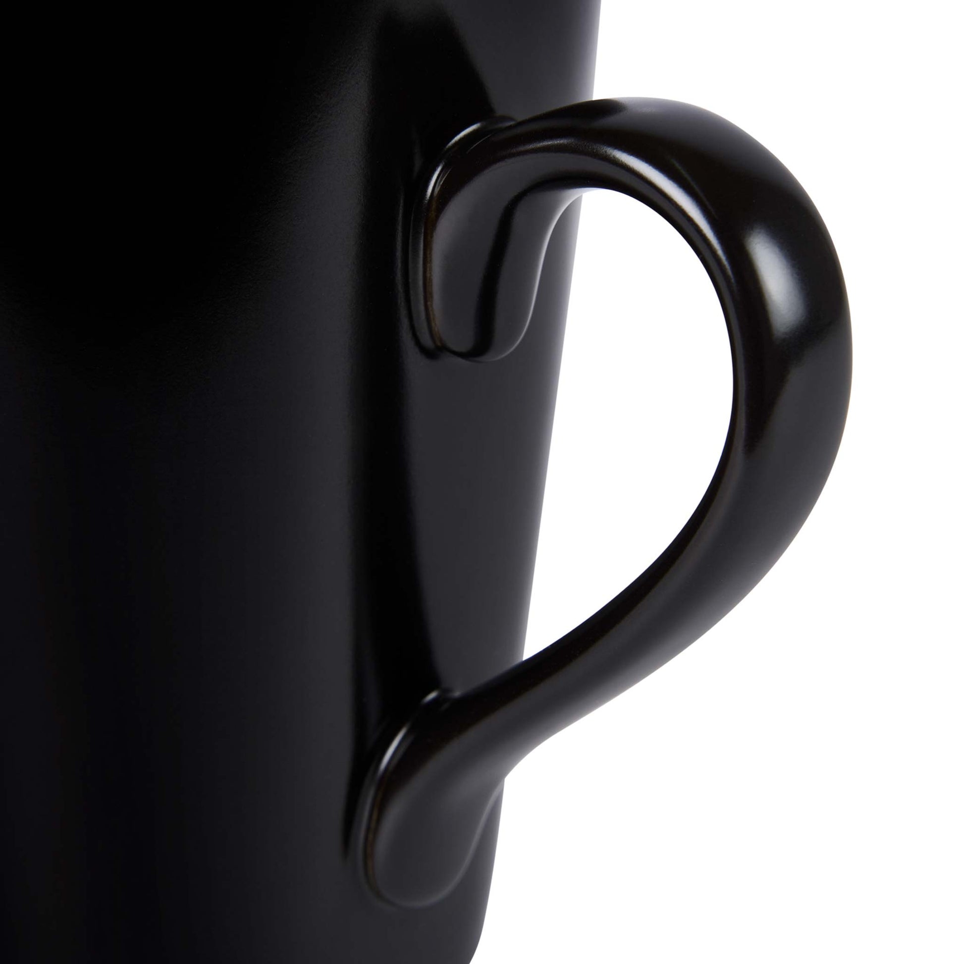Close-up of the Corby Fenton black ceramic mug handle showcasing smooth ergonomic design for comfortable grip