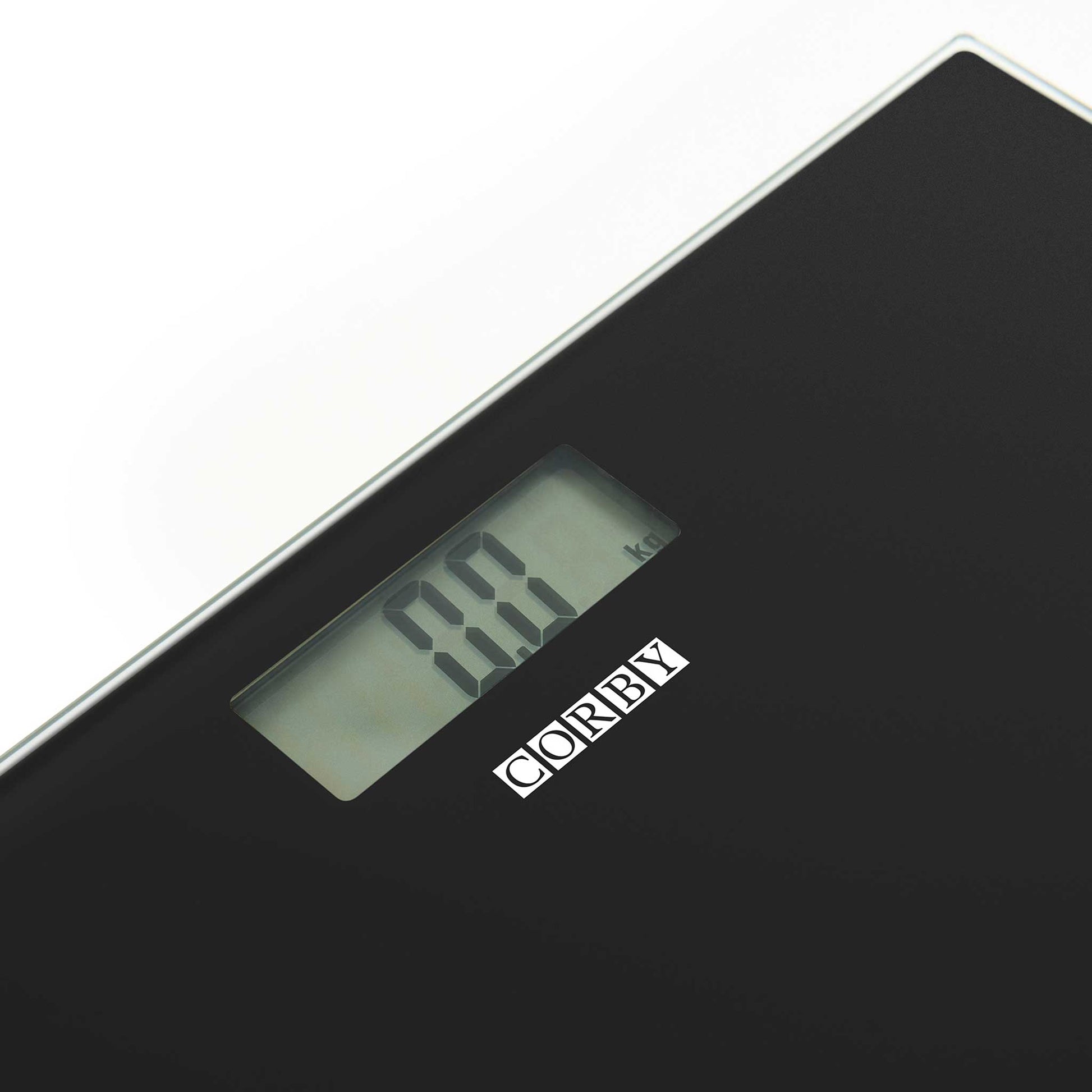 Close-up of Corby Helmsley black digital bathroom scales showing LCD display with kg measurement