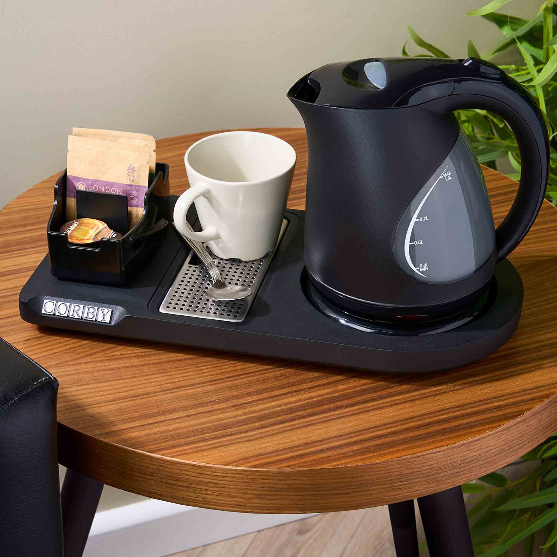 Corby Lancaster Black 1L Kettle on Lancaster hospitality tray with mug, tea selection and spoon in hotel room setup