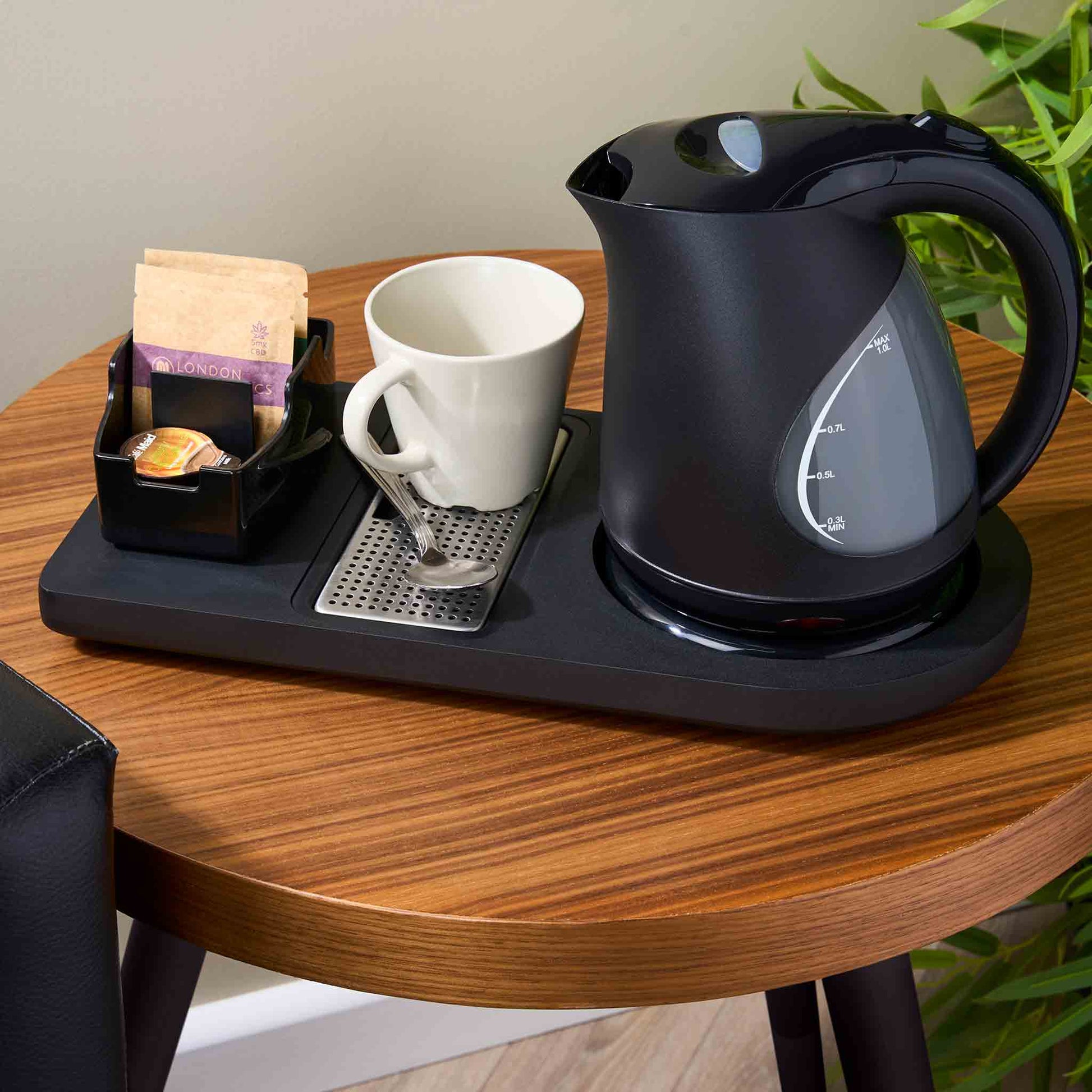 Corby Lancaster Black 1L Kettle on Lancaster hospitality tray with mug, tea selection and spoon in hotel room setup