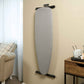 Corby Oxford light grey ironing board mounted on wall in hotel guest room beside coffee tray and armchair