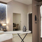 Corby Oxford light grey ironing board with iron set up in hotel bedroom, wall-mounted iron holder visible in wardrobe