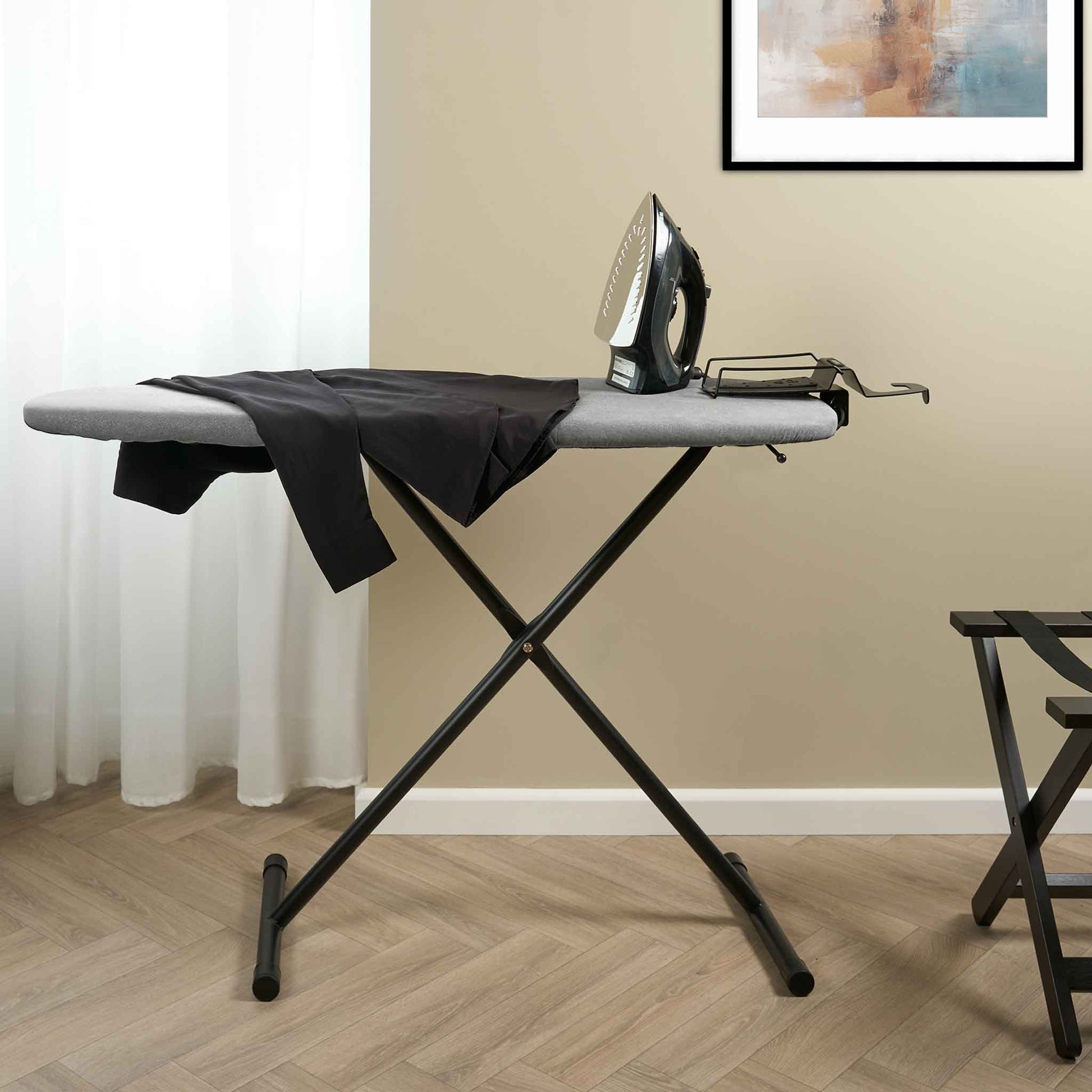 Corby Oxford Premium Ironing Centre with 2000W steam iron and guest shirt in hotel room with wood flooring and luggage rack