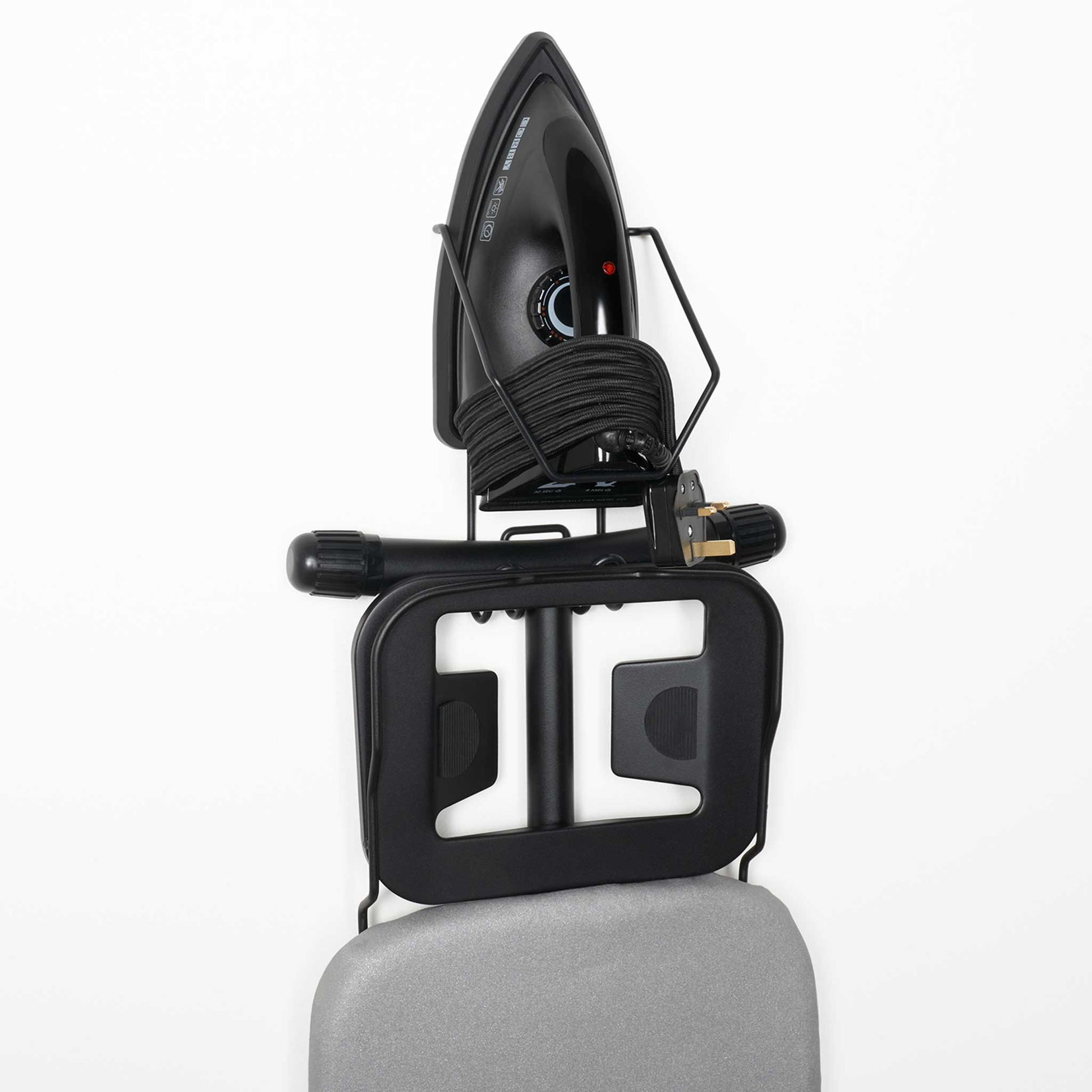 Corby Sherwood wall-mounted holder storing 1200W black hotel iron and light grey ironing board in compact vertical setup