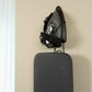 Corby Sherwood holder mounted on hotel room wall securely storing 1200W black iron and dark grey ironing board