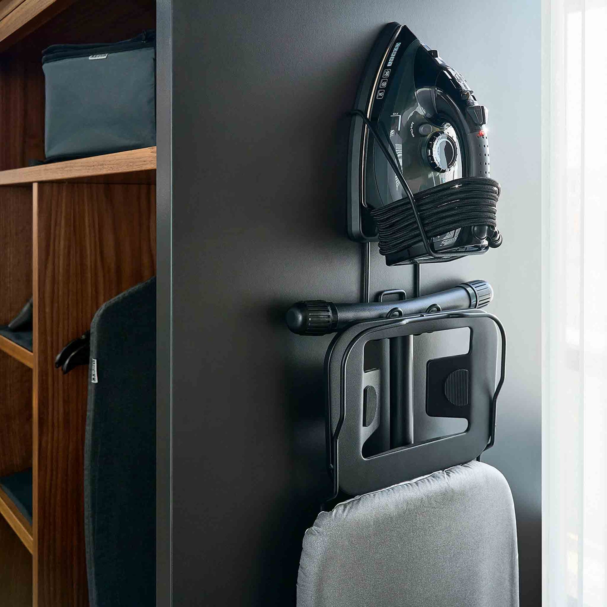 Corby Sherwood wall-mounted iron and ironing board holder in hotel wardrobe with 2000W black steam iron and compact foldable board