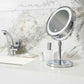 Corby Winchester chrome LED vanity mirror with touch sensor on hotel bathroom counter beside toiletries and chrome tap
