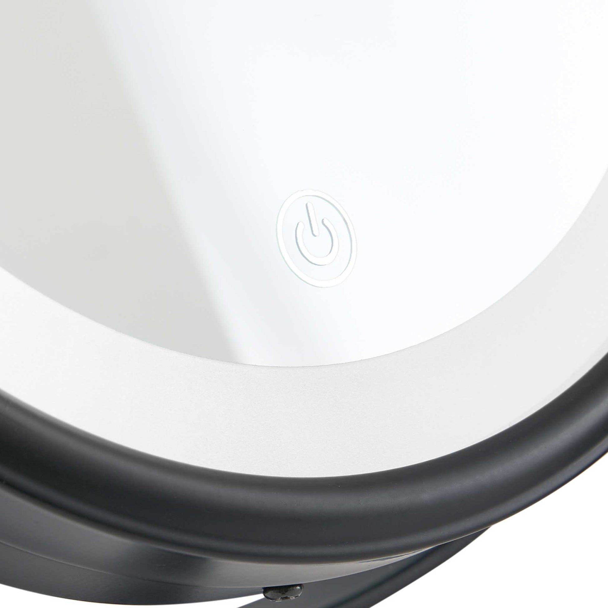 Close-up of Corby Winchester LED vanity mirror showing illuminated touch sensor power button and matt black frame