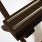 Close-up of Corby York dark wood luggage rack showing chrome inlay detail on top rail