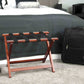 Corby York mahogany luggage rack next to hotel bed