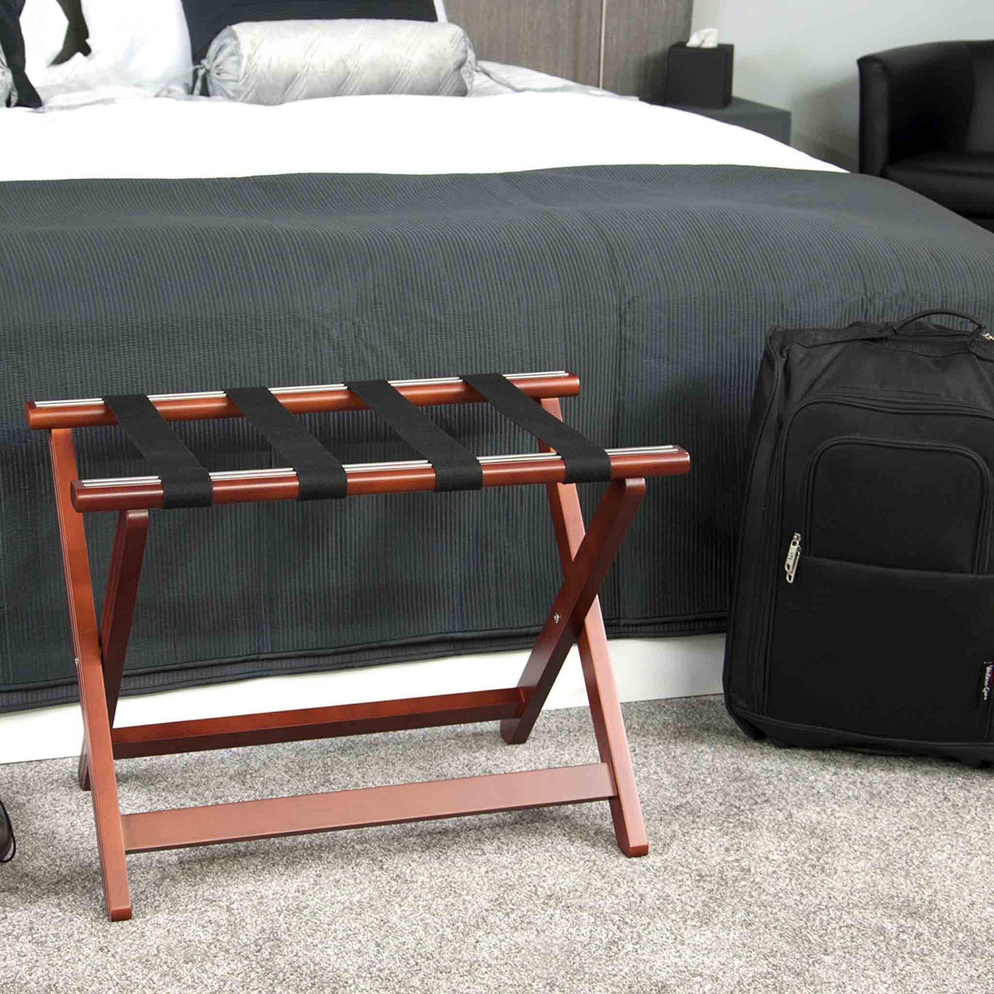 Corby York mahogany luggage rack next to hotel bed