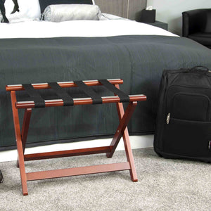 Corby York mahogany luggage rack next to hotel bed