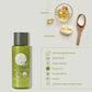 Geneva Green body lotion bottle with shea butter and vitamin E capsules on a light background