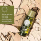 Bottle of Geneva Green body wash on a leafy background with circular economy label.