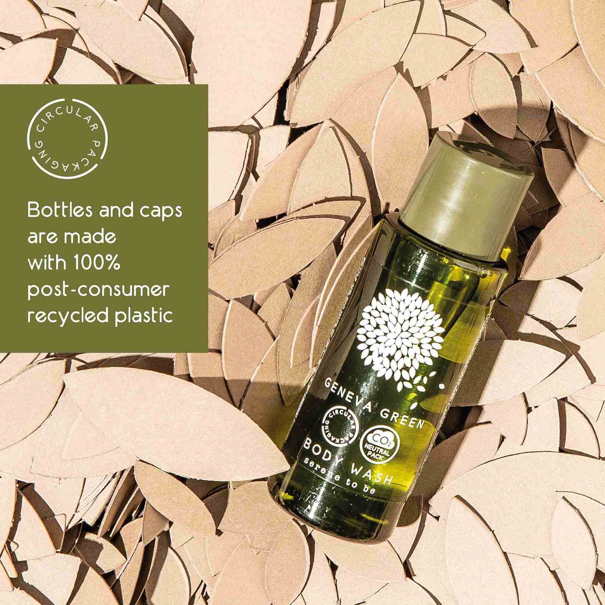 Bottle of Geneva Green body wash on a leafy background with circular economy label.