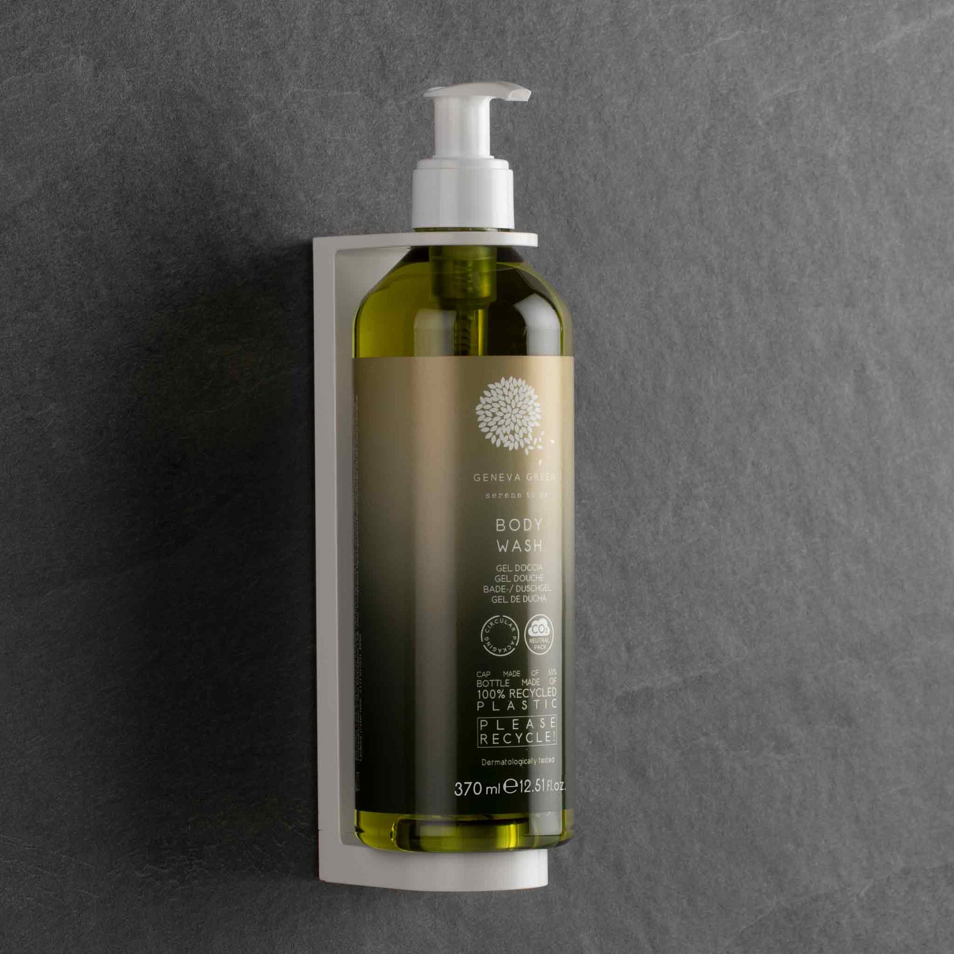 Geneva Green body wash pump dispenser in wall bracket