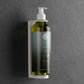 Geneva Green shampoo pump dispenser in wall mounted bracket