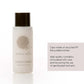 White bottle of Geneva Guild conditioner with sustainability text on a white background