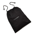 Black cotton drawstring laundry bag with grey 'LAUNDRY' embroidered text