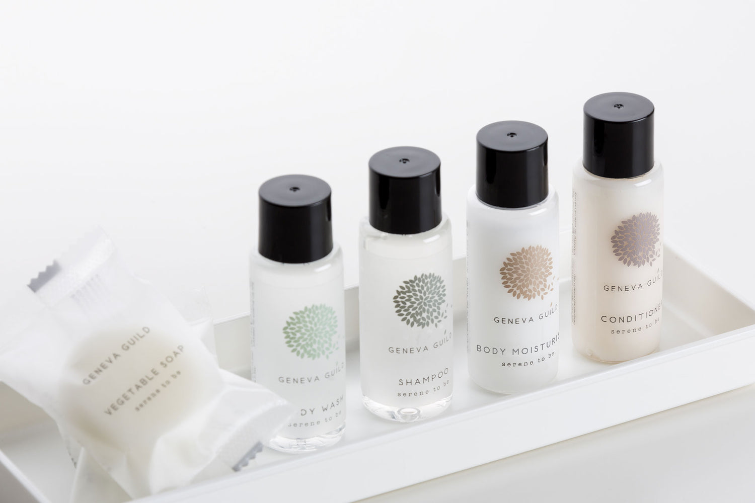 Hotel toiletries collection featuring miniature Geneva Guild soap