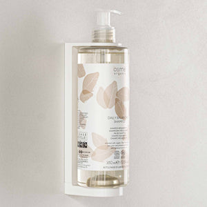 Osme Organic shampoo pump dispenser in wall mounted bracket